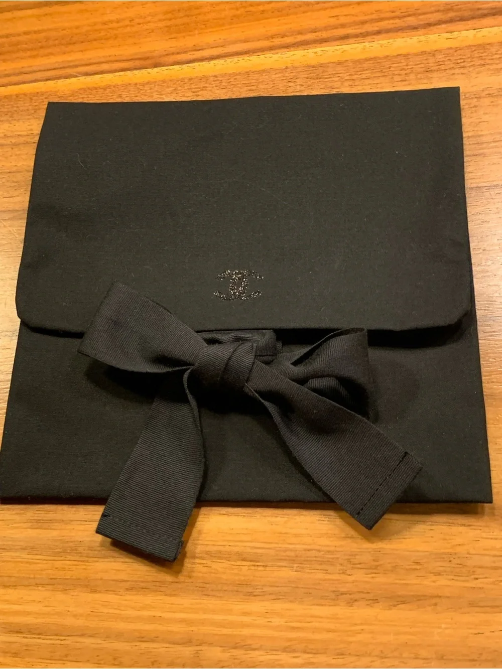 Authentic  black Chanel rare pouch with CC sparky logo with closing strops.Must!